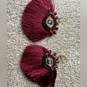 Evil eye tassel earrings